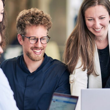 Group of Master in Management students working together.