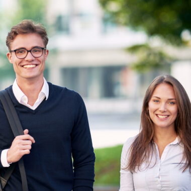 two HHL students smiling.