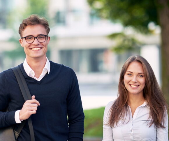 two HHL students smiling.