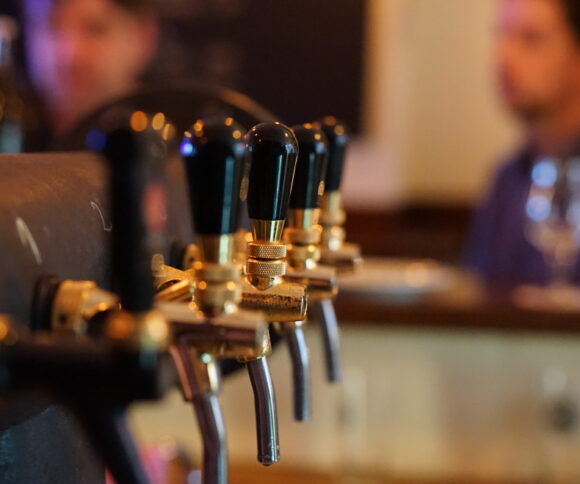 Beer taps in a bar.