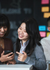 2 international female MBA students talking about something