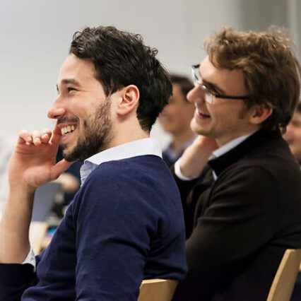 Two part-time MBA Students laughing.
