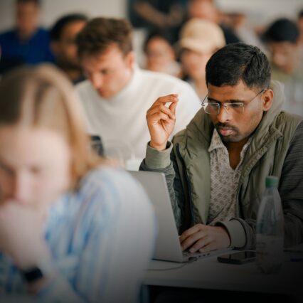 Student looking at his laptop