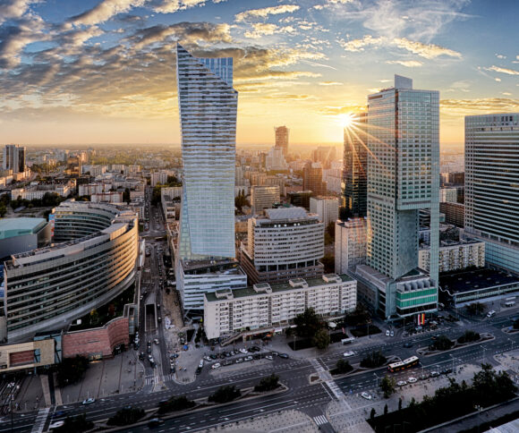 Warsaw city with modern skyscraper at sunset, Poland